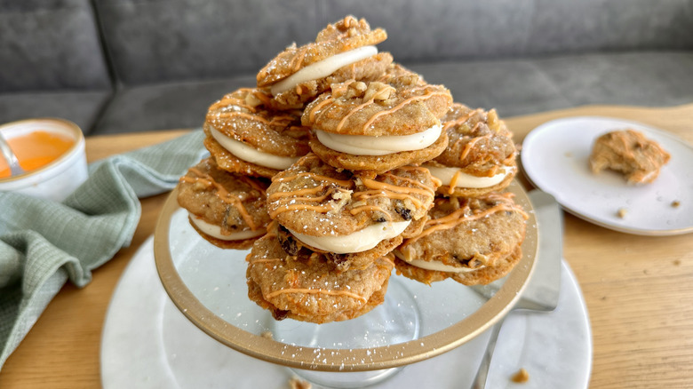 Carrot cake cookies stacked onto cake display platter