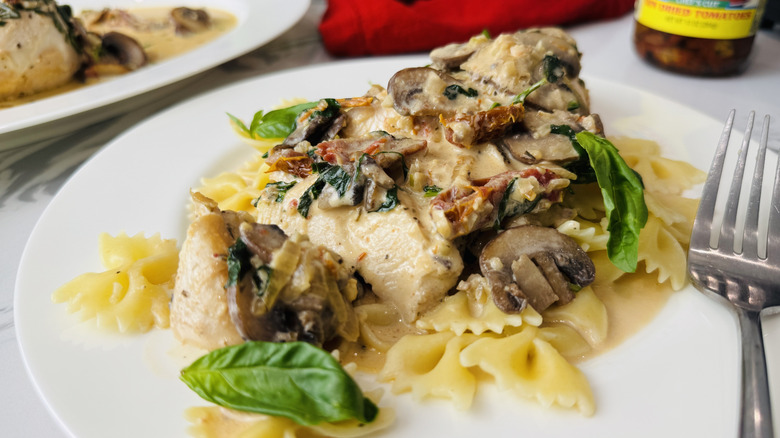Tuscan chicken serving on plate