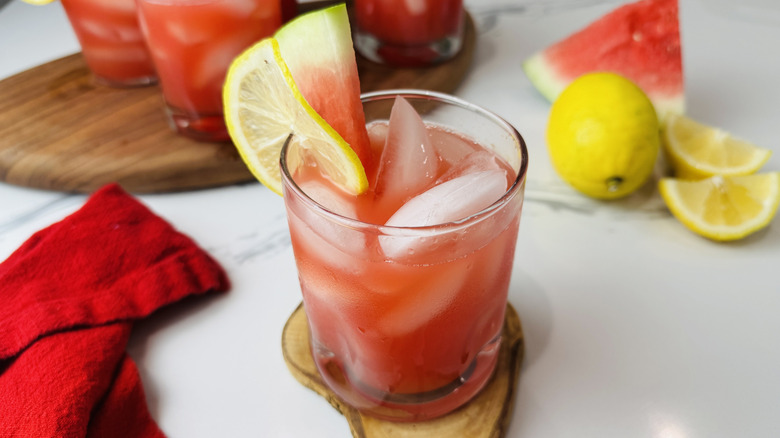 watermelon lemonade wtih fruit garnish in glass