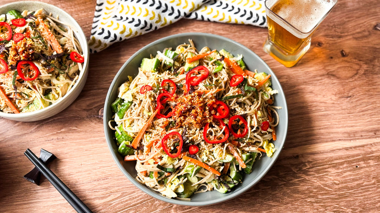 Chilled soba salad with leftover rotisserie chicken in serving bowls