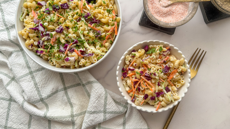 Macaroni salad in serving bowl and smaller bowl