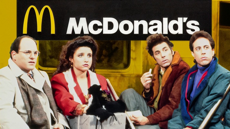 Seinfeld cast in front of a McDonald's sign